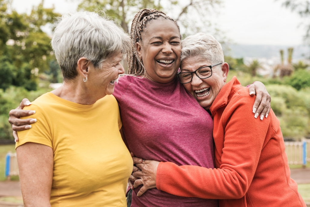 Three women hugging