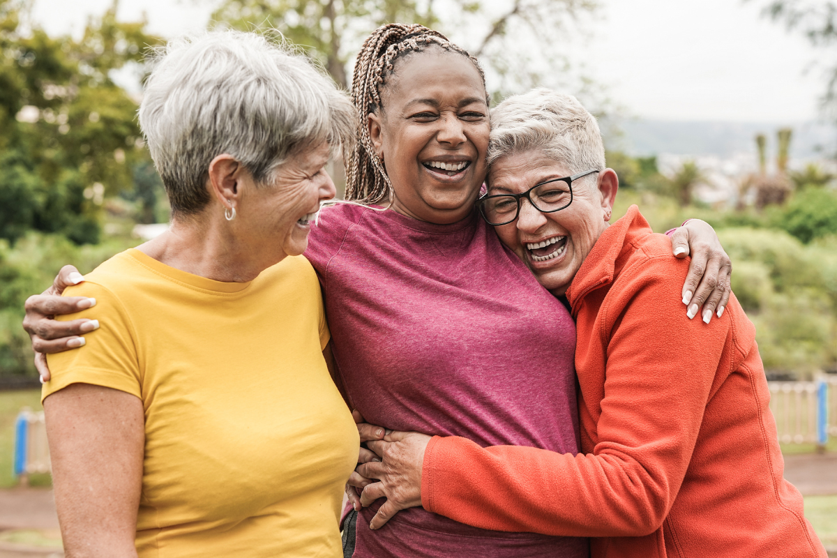 Three women hugging