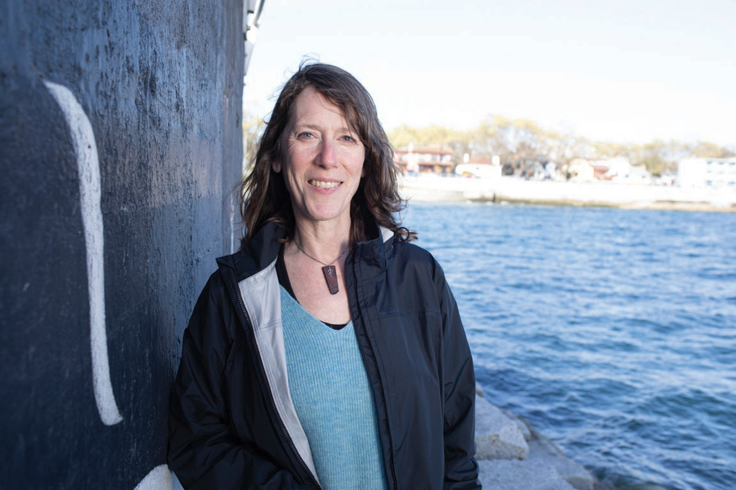 Christianne Wilhelmson, former Executive Director, Georgia Strait Alliance, portrait with ocean. 