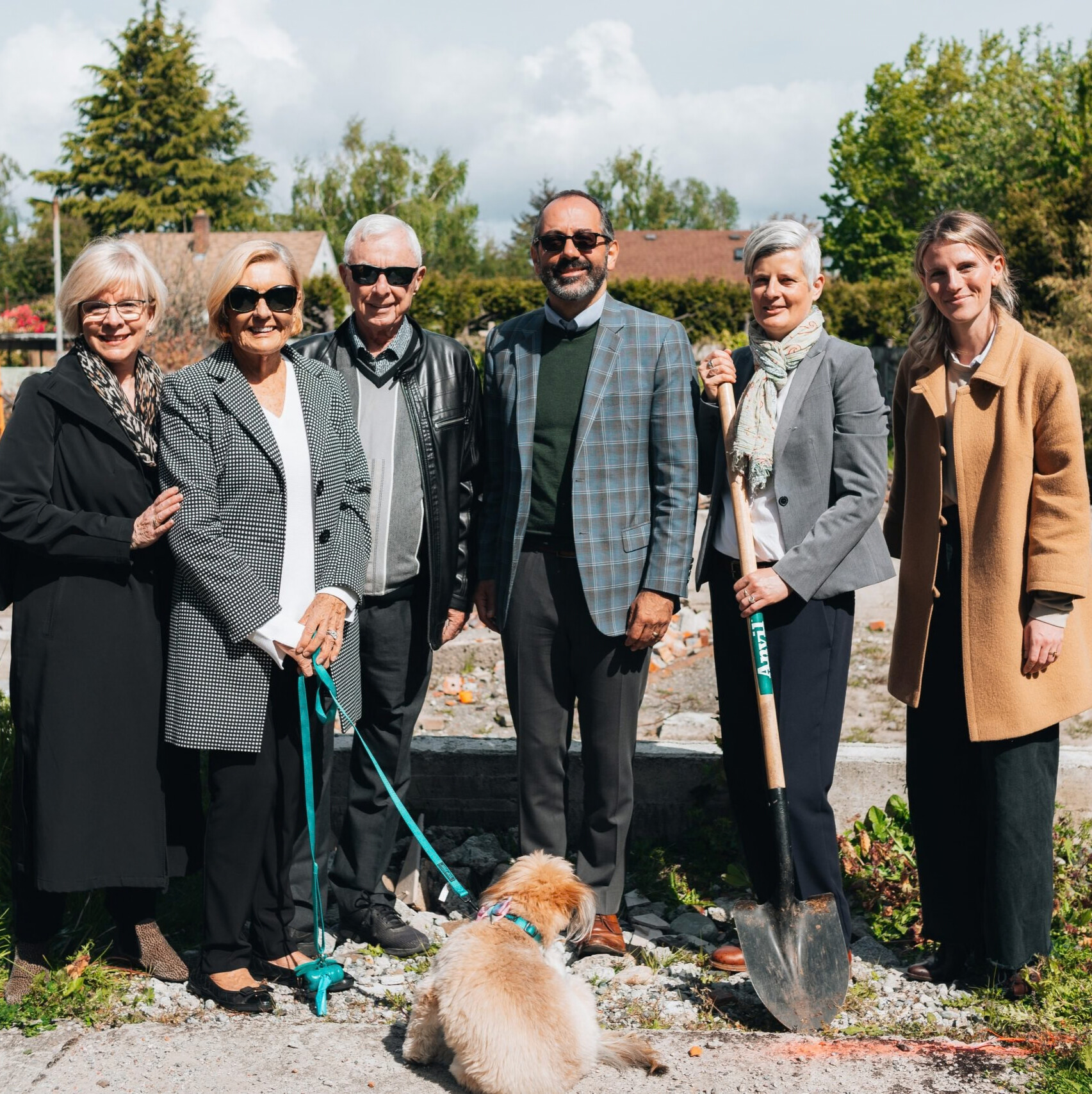 Local donors Clint and Carole Forster stand with other members of the community.