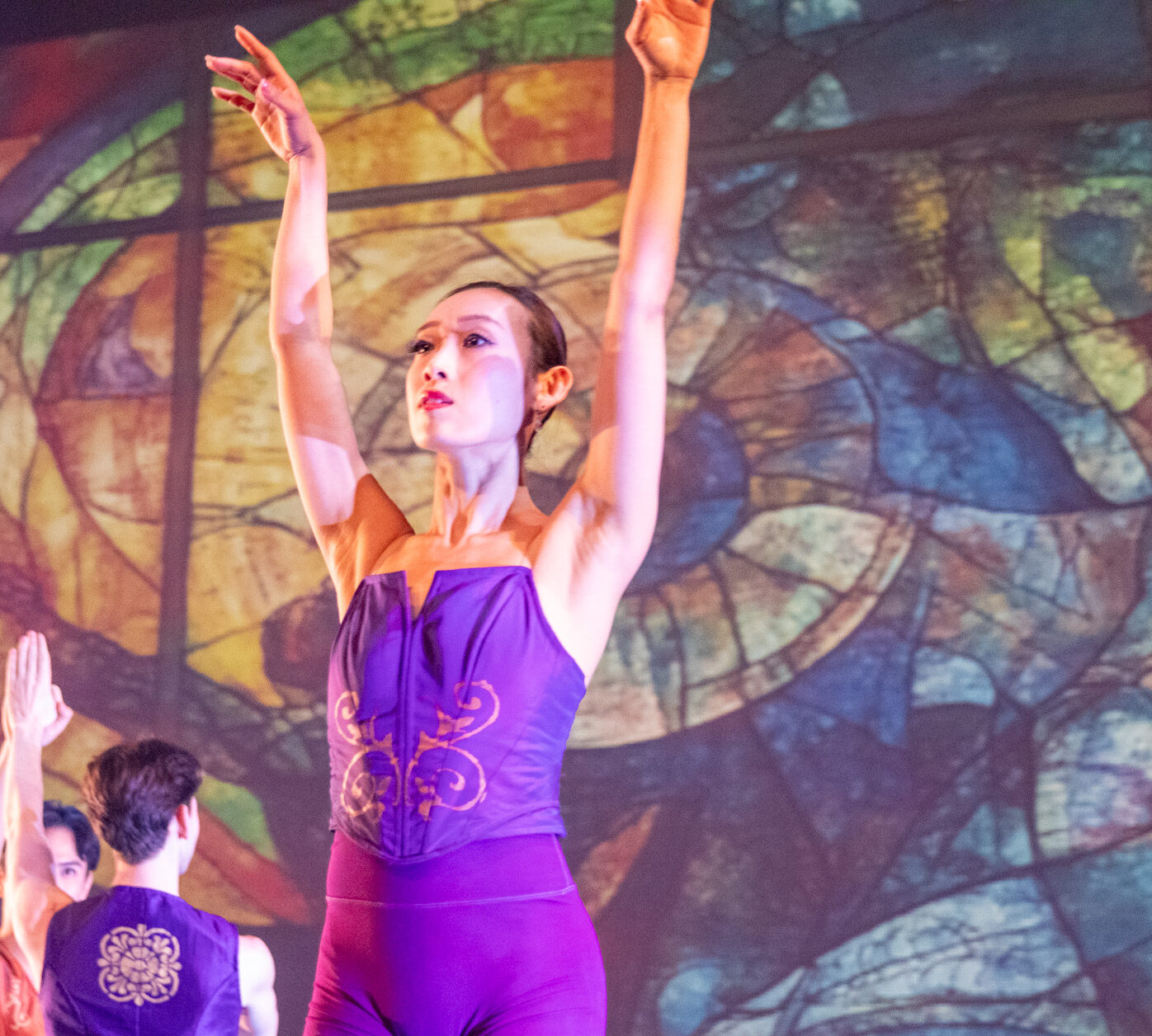 Performance by Ballet Victoria, dancer stands dramatically before audience.