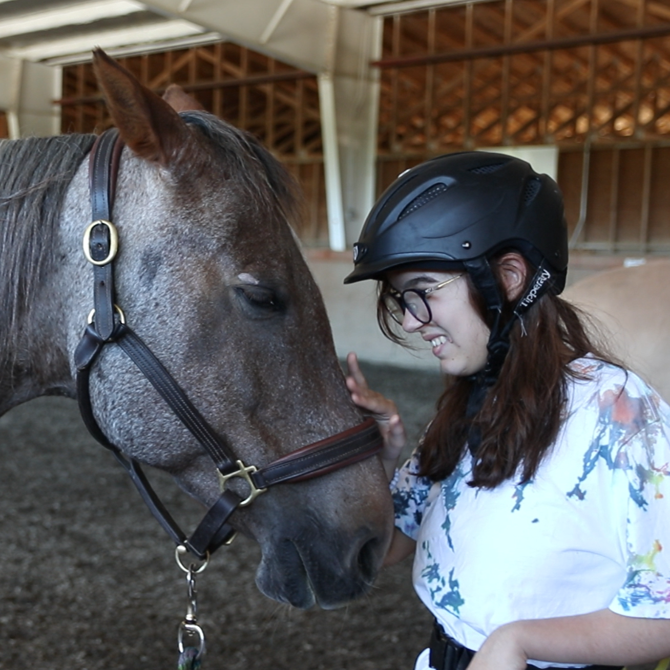 A girl and her horse at the Victoria Therapeutic Riding Association.