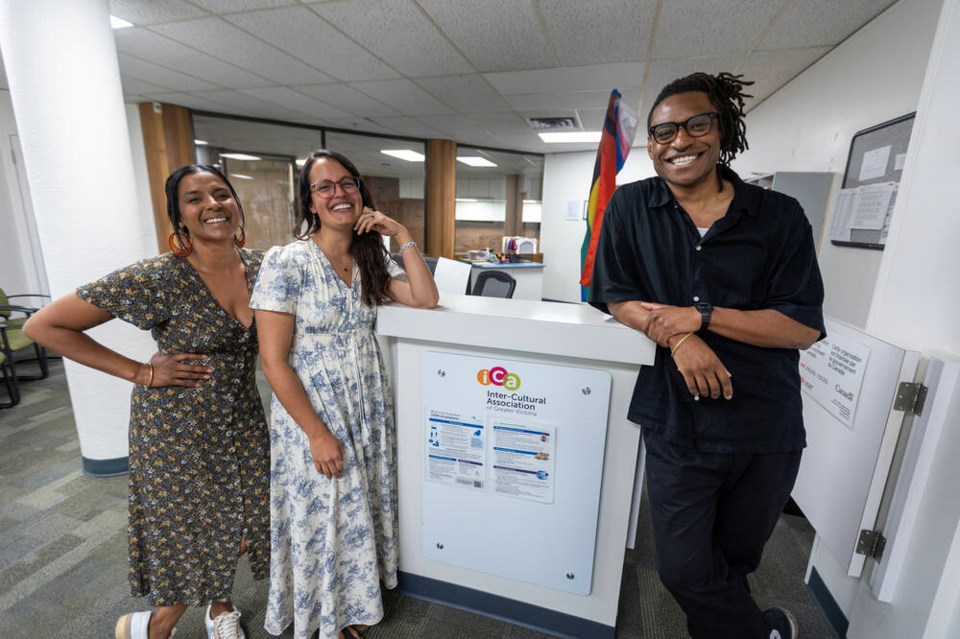 Staff members, left to right, Tricia Khan, Mariana Restrepo and Parker Johnson at the Inter-Cultural Association of Greater Victoria on Wednesday.